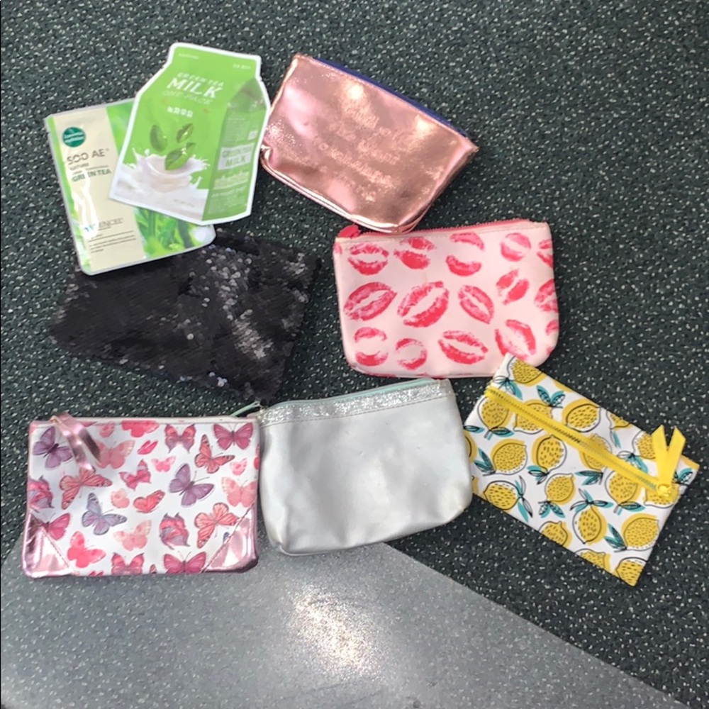 Empty Ipsy bags and two face masks